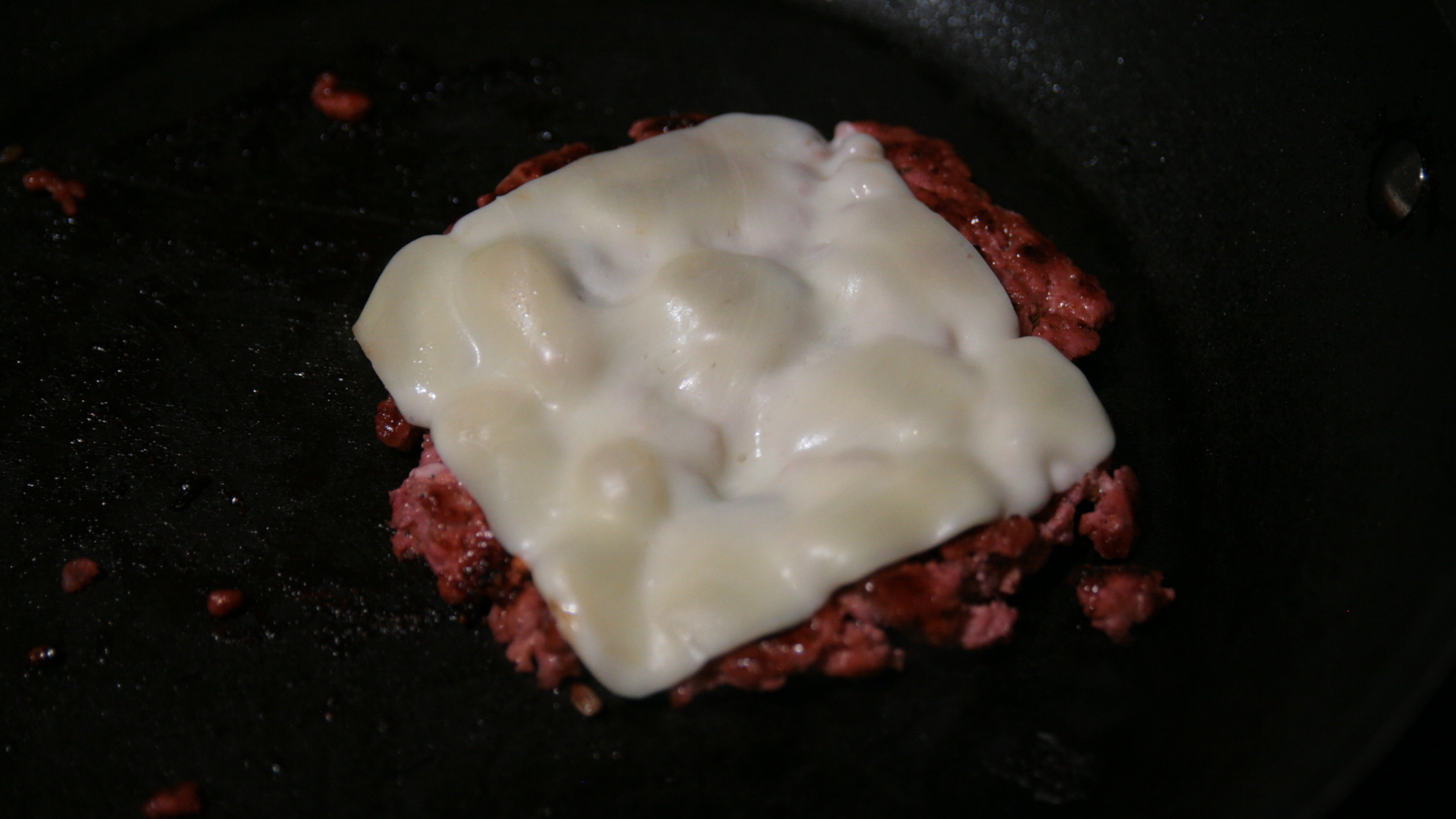 italian sausage grilling on pan