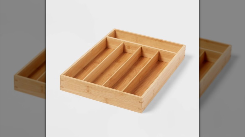 The Brightroom Natural 5 Compartment Flatware Drawer Organizer from Target on a grey background.