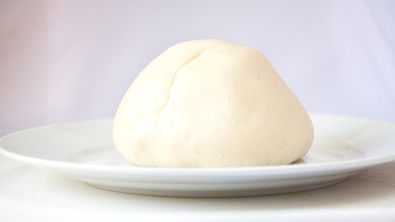 Pounded yam fufu on a white plate