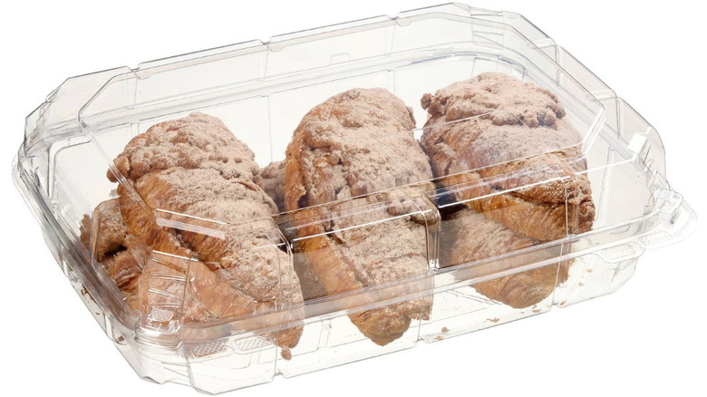 Kirkland Signature Twice Baked Cinnamon Filled Croissants in a clear plastic container on a white background