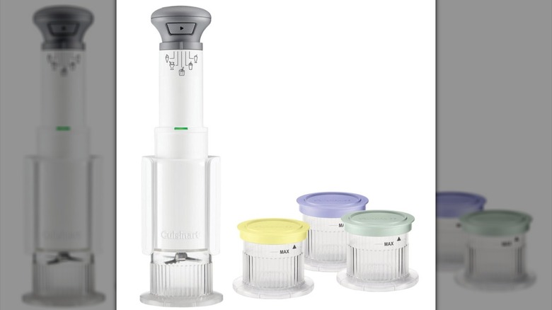 A tall, slim ice cream maker that resembles an immersion blender and three round storage containers with colorful lids on a white background.