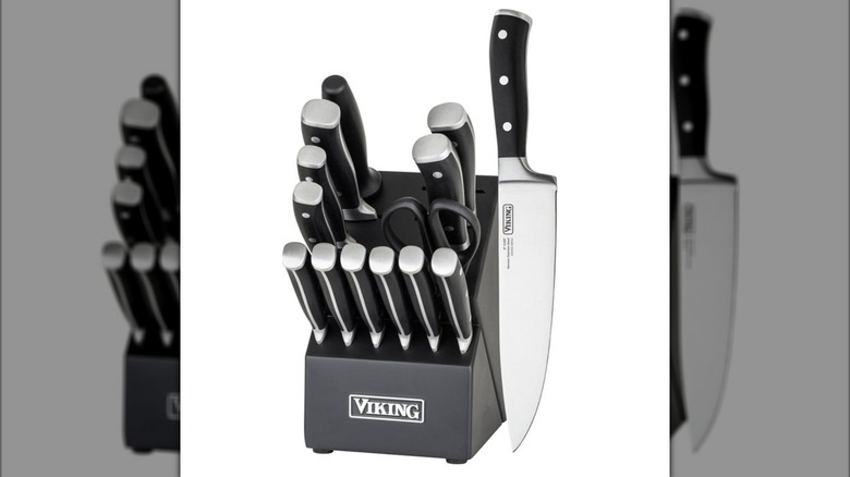 A knife block with several black-handled knives set in it and a Viking logo on a white background.
