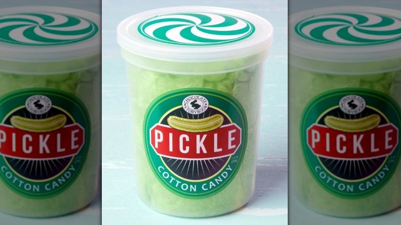 A plastic container of pickle-flavored cotton candy from Fairy Tale Cotton Candy.