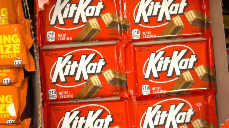 Packs of KitKat bars on display.