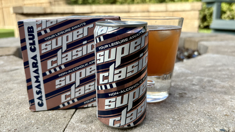 A box, can, and glass of Casamara Club Superclasico mocktail