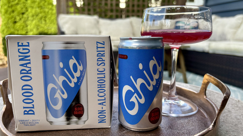 A box, can, and glass of Ghia Blood Orange non-alcoholic spritz