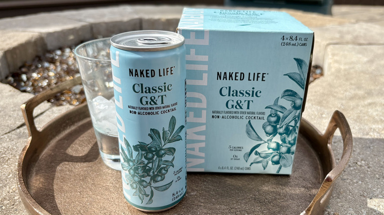 A 4-pack box and can of Naked Life Classic G&T on a tray
