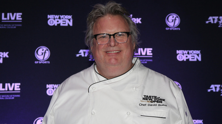 David Burke wearing white chefs coat and smiling