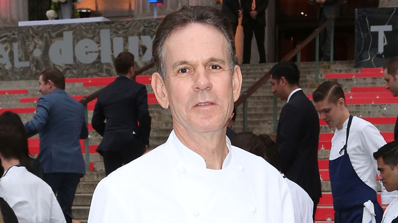 Thomas Keller wearing white chefs coat in an outdoor setting
