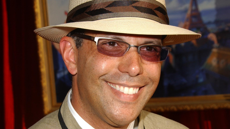 Juan-Carlos Cruz smiling in hat and sunglasses
