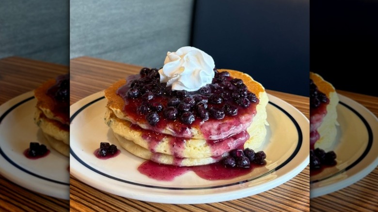 A plate of IHOP's Double Blueberry Pancakes on a table