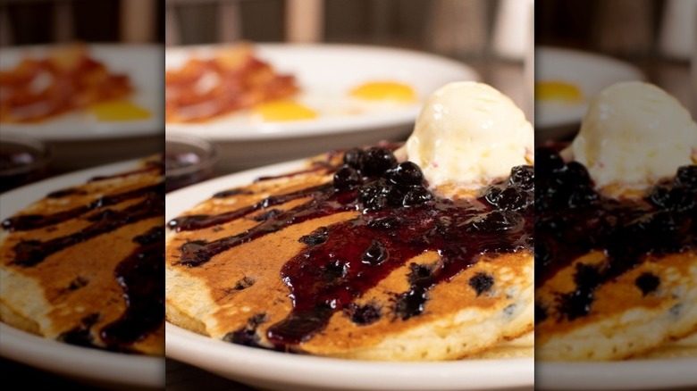 Cracker Barrel's Blueberry Pancakes topped with blueberry syrup and butter