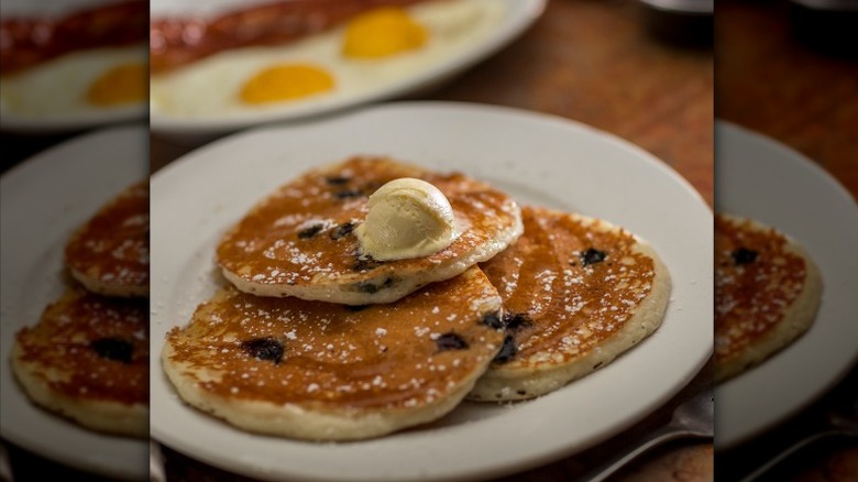 Three of Perkins Blueberry Buttermilk Pancakes on a plate