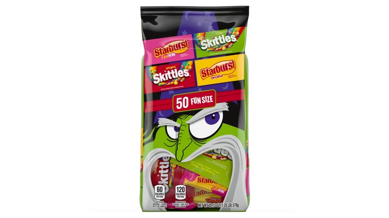 Product image of Skittles, Skittles Sours, Starburst, and Starburst FaveREDS Halloween Candy on a white background.