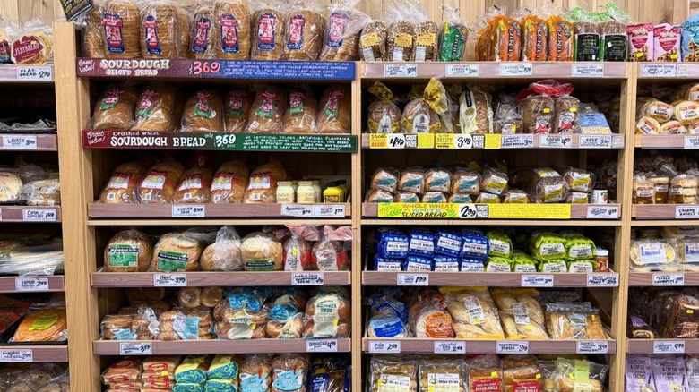 Trader Joe's bread aisle lined with rows of options like sourdough and sliced bread
