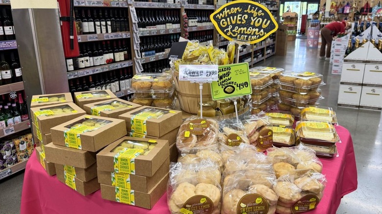 Seasonal tabble set up in Trader Joe's with spring bakery items like lemon scones, cookies, and muffins