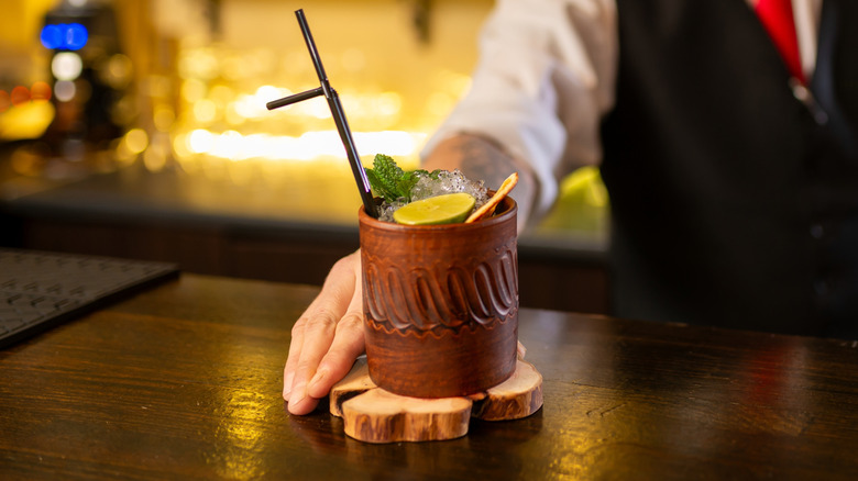 Bartender making craft alcohol beverage