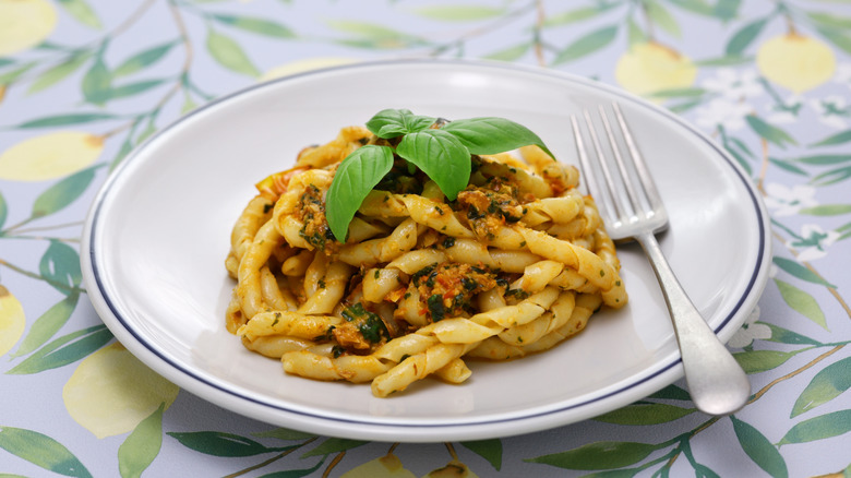 Plate of busiate pasta with a fork