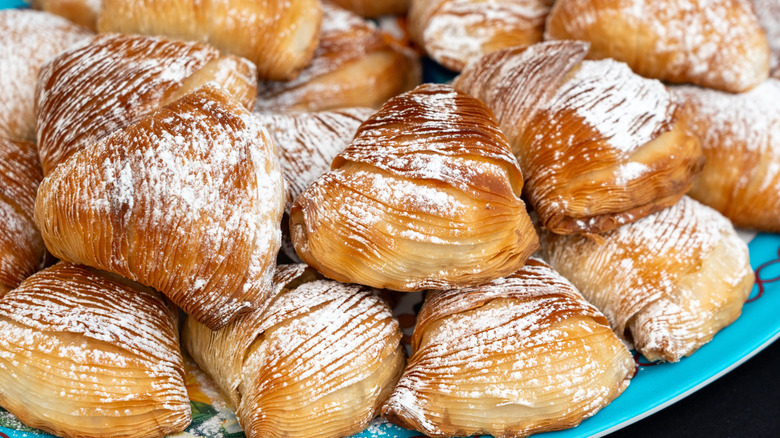 Sfogliatella pastries on a blue plate