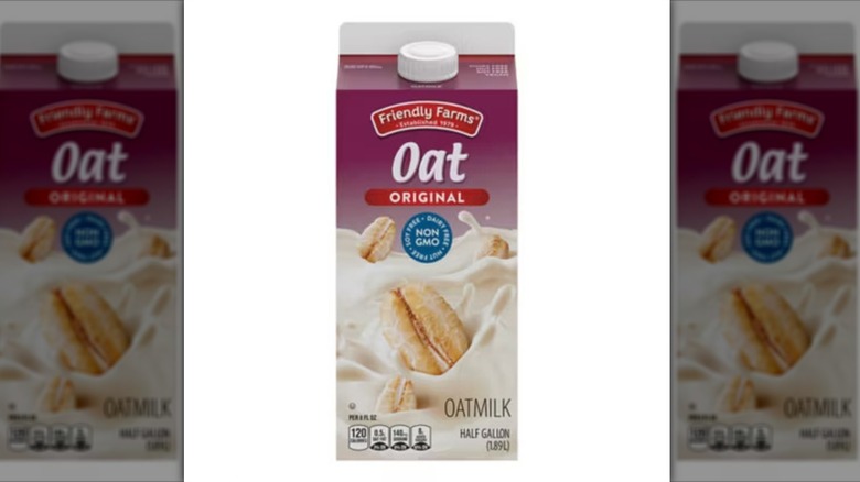 A container of Friendly Farms Oat Milk on a white background