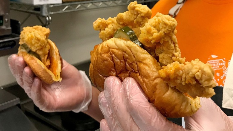 Popeyes fried chicken wrapped in folded burger buns to look like tacos