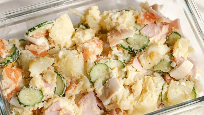 Japanese potato salad (potesara) with ham, carrot, cucumber, and egg in a glass container