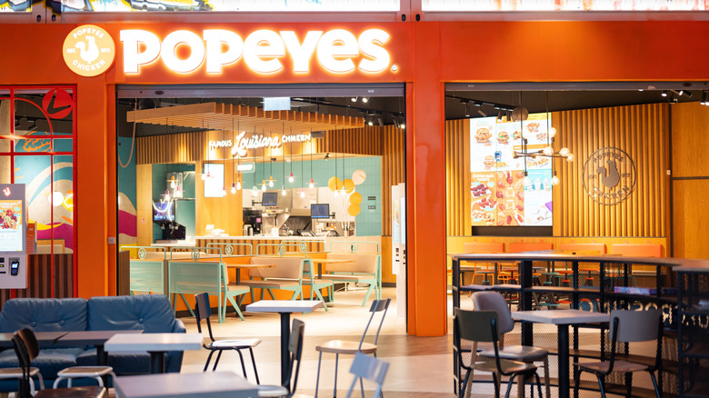 The dining area and counter of a Popeyes.