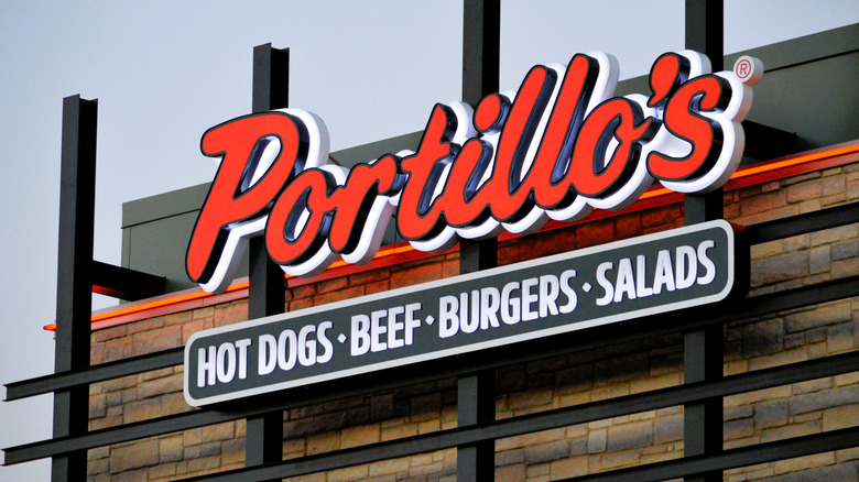 A Portillo's sign on the restaurant facade