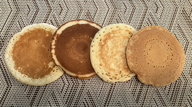 four pancakes of various shades lined up in a row