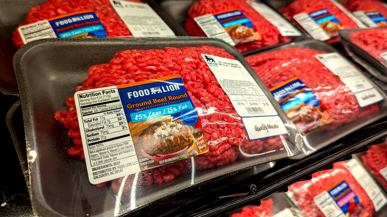 Packages of raw ground meat on a store shelf