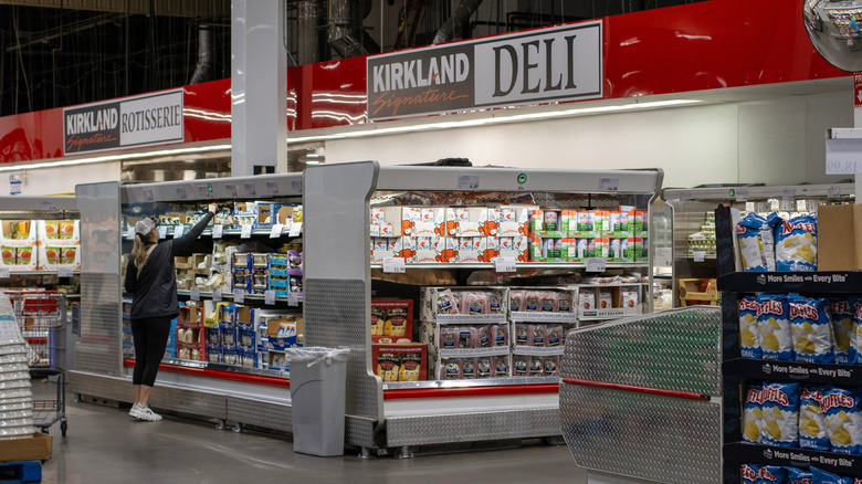 A shopper browses the Costco deli