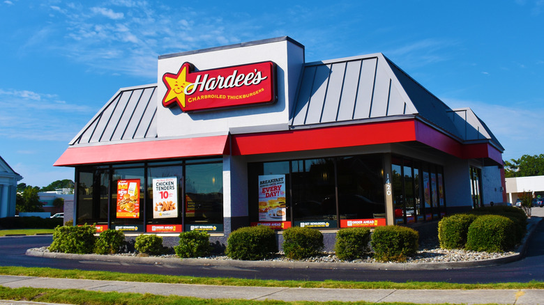 Exterior of a Hardee's with a sign, day