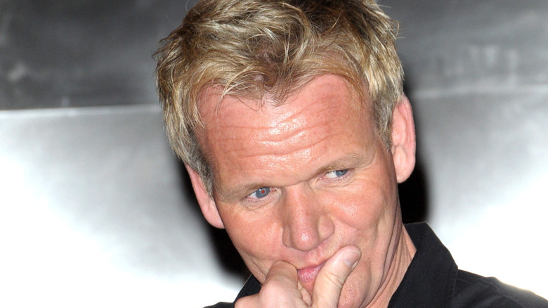 Chef Gordon Ramsay with his fingers on his lips