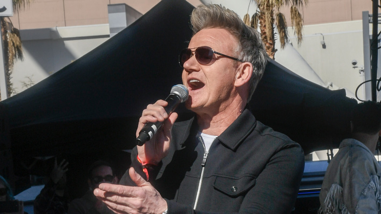 Chef Gordon Ramsay talking into a microphone