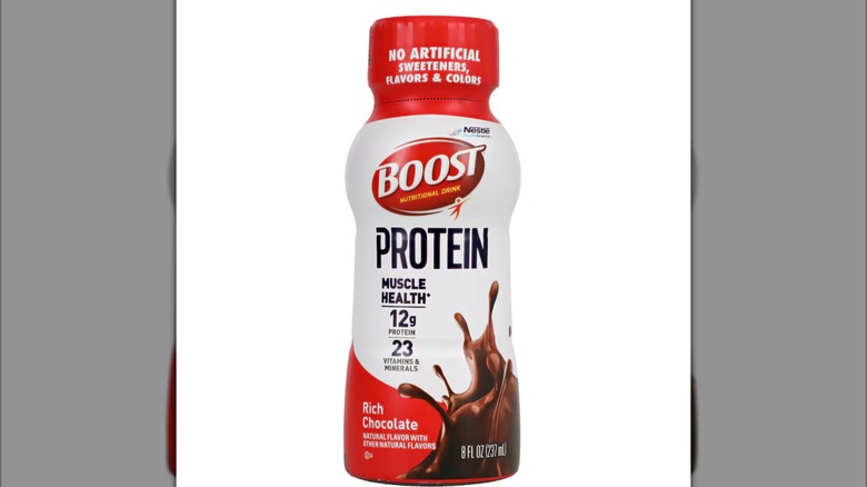A bottle of Boost Protein Rich Chocolate Nutritional Drink on a white background.