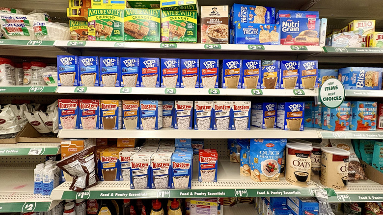 Dollar store aisle filled with breakfast food items like Pop-Tarts .