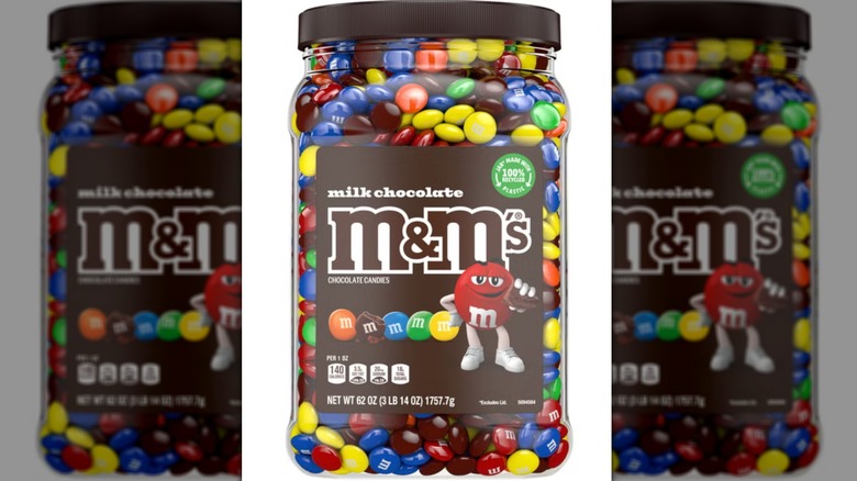 Jar of milk chocolate M&M's in 62-ounce jar on white background