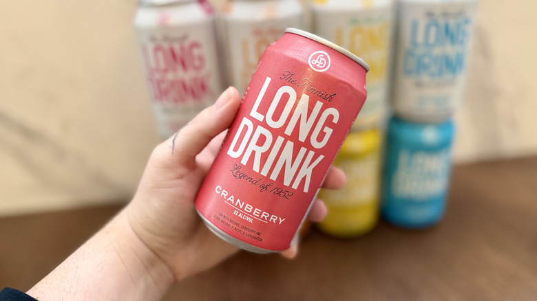 Hand holding a can of cranberry Long Drink