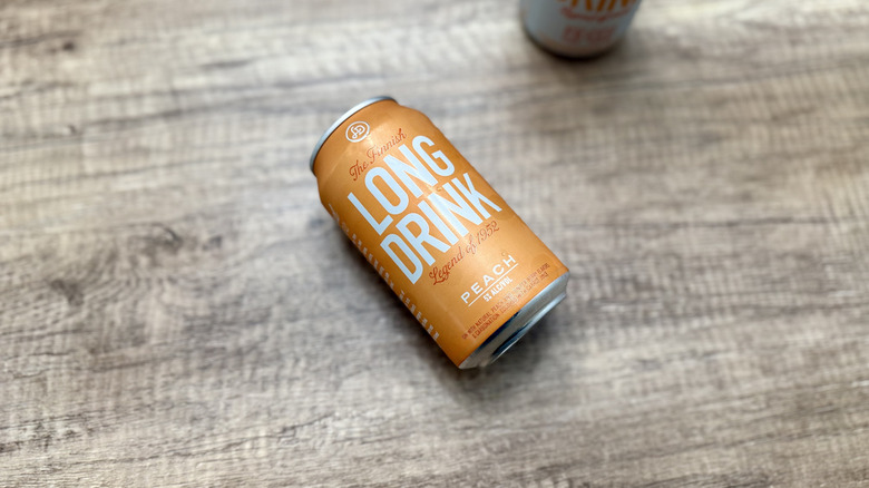 Peach Long Drink laying on a wooden table