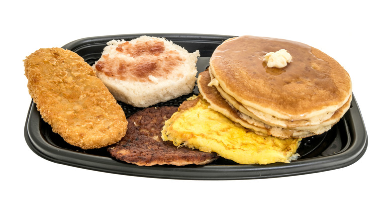 a McDonald's big breakfast with hotcakes against a white background