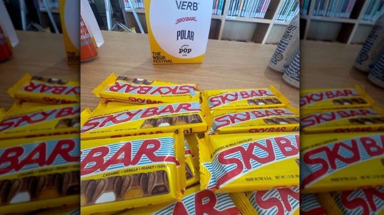 A number of Sky Bar candy bars on a wooden table.