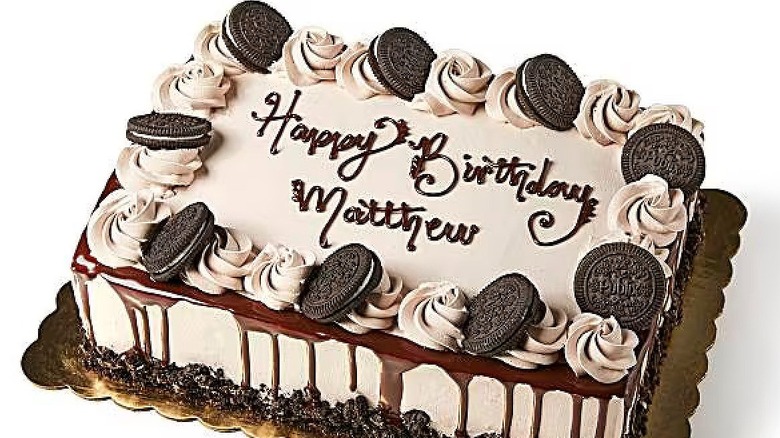 Publix sheet cake topped with Oreo cookies and a message that reads "Happy Birthday Matthew"