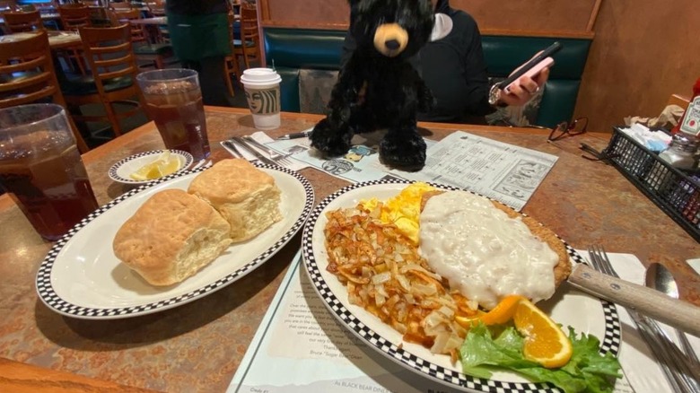 Chicken fried steak with gravy and a plate of biscuits from Black Bear Diner