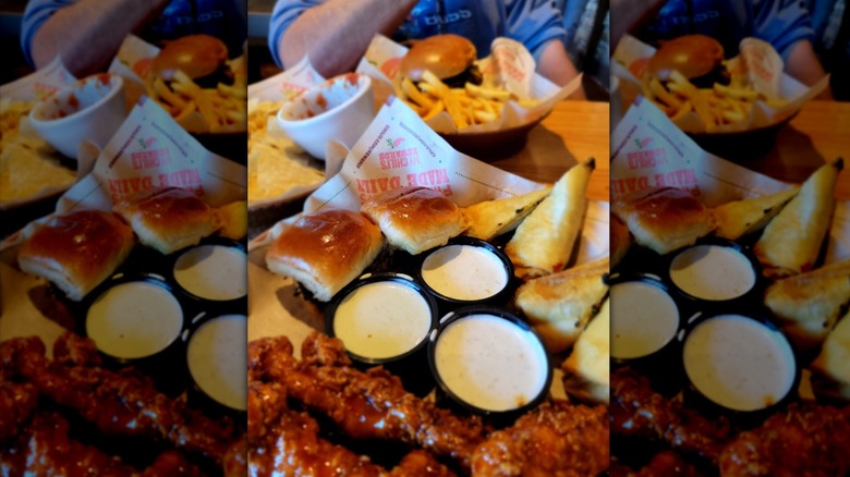 Chicken wings, sliders and dips in a basket from Chili's