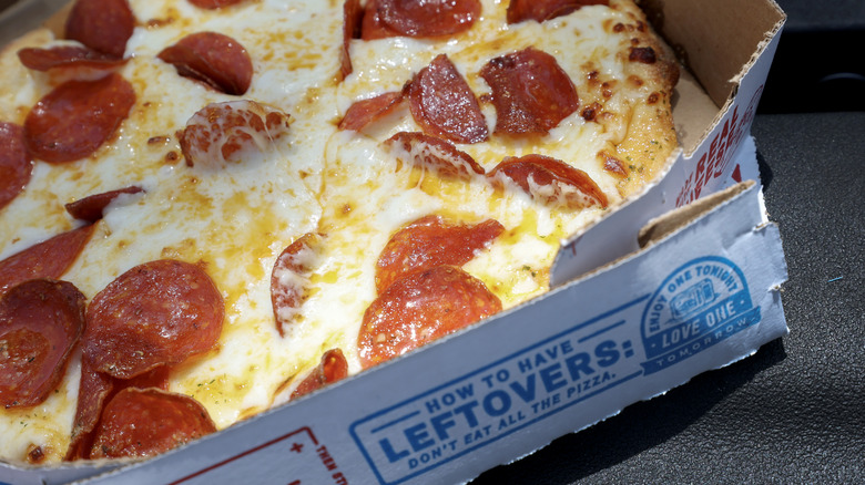 Pepperoni pizza in a Domino's box