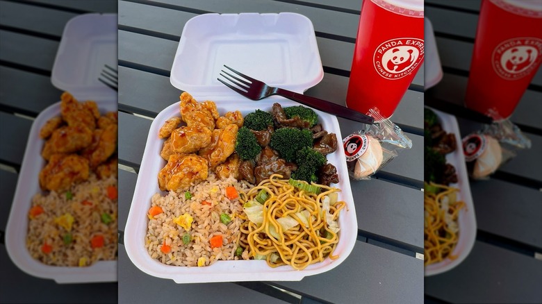Panda Express drink and takeout container filled with orange chicken, broccoli beef, fried rice, and chow mein