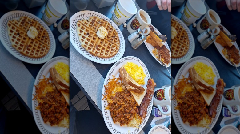 Waffle House waffle with a separate plate of hash browns, eggs, bacon, and toast
