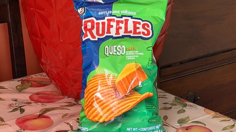 A bag of Ruffles queso potato chips