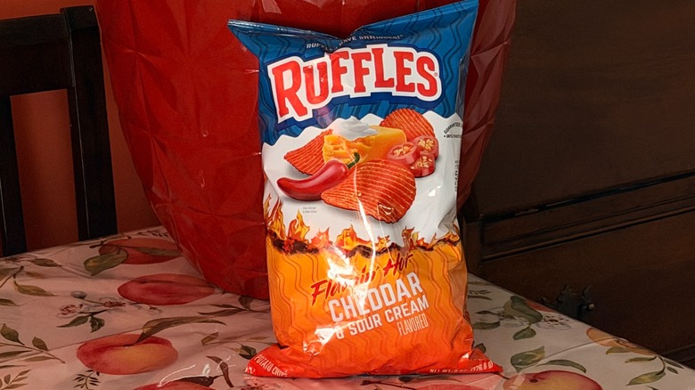 A bag of Ruffles Flamin' hot cheddar and sour cream potato chips