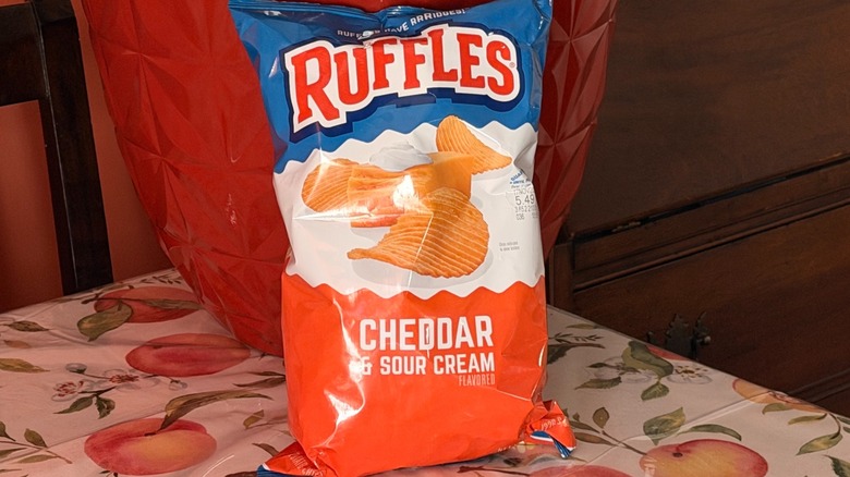 A bag of Ruffles cheddar and sour cream potato chips
